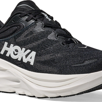 Quarter turn view Women's HOKA Footwear style name Gaviota 6 XWide in color Black/ White. Sku: 1171937-BWHT