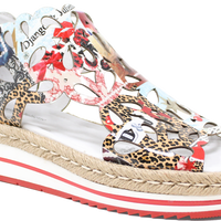 Multicolored floral and animal print sandal with a thick sole on a white background