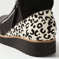 Wedge shoe with leopard print pattern on a white background