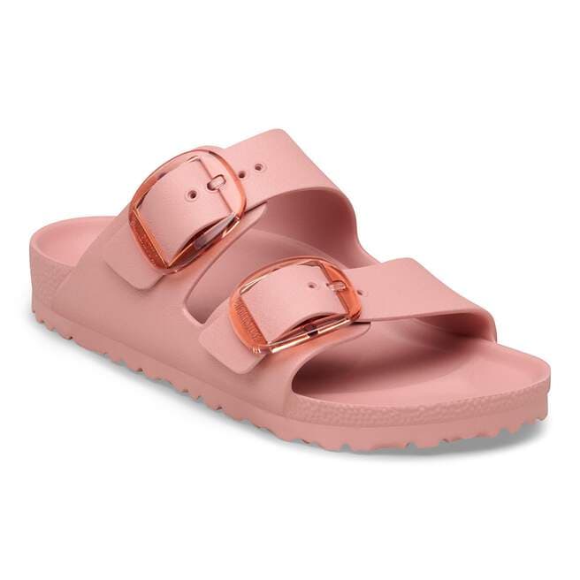 Pink sandal with rose gold buckles on a white background