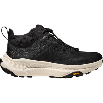 Quarter turn view Women's Hoka Footwear style name Transport Chukka GTX in color Black/ Alabaster. Sku: 1155191BKLB