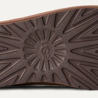 Brown shoe sole with geometric pattern on a white background