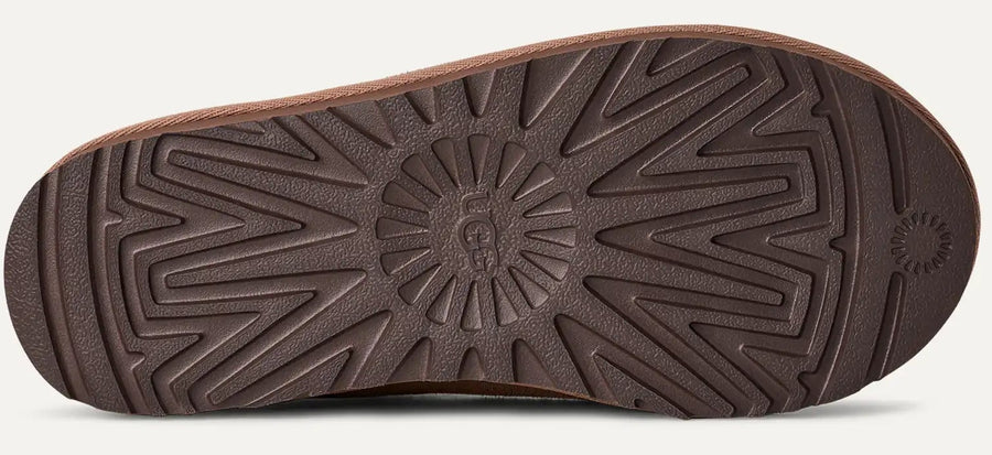 Brown shoe sole with geometric pattern on a white background