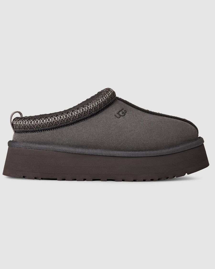 Gray slip-on shoe with a thick sole on a light gray background