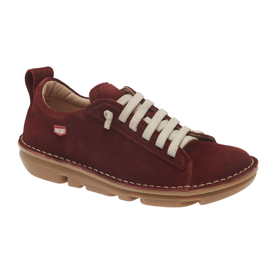 Maroon sneaker with white laces on a white background