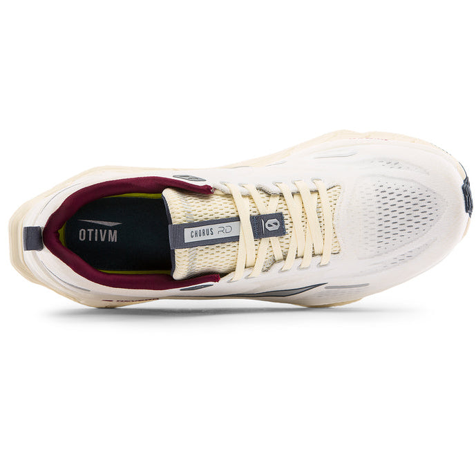 White athletic shoe with red accents on a white background