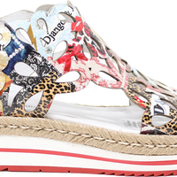 Colorful sandal with animal print patterns on a white background