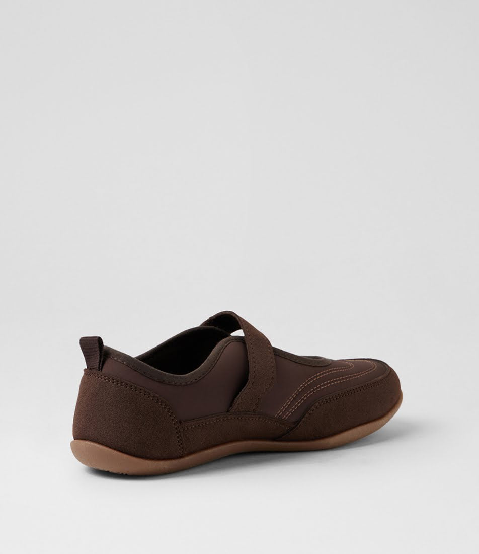 A dark brown slip-on shoe with a textured fabric upper and a light brown sole, shown from a side-rear angle on a light gray background.