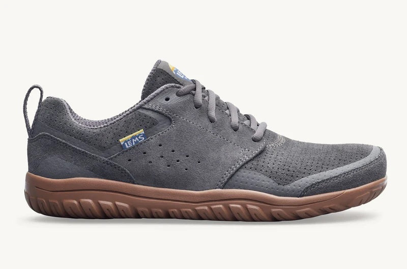 Gray sneaker with brown sole on a white background