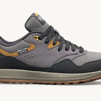 Gray and black sneaker with brown accents on a white background