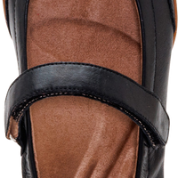 A single black leather Mary Jane shoe shown from a top-down angle, featuring a brown contoured insole and a hook-and-loop strap closure. The brand name 'cellex' is visible on the insole.