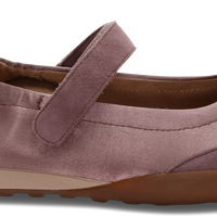 A single Exo brand Mary Jane shoe in a dusty mauve-purple color, featuring a suede-like finish, a hook-and-loop strap, a white heel tab, and a brown sole, shown against a plain white background.