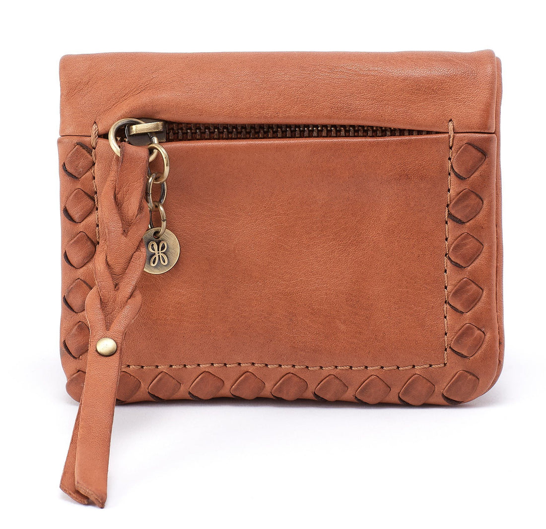 Brown leather wallet with braided strap and gold accents on a white background