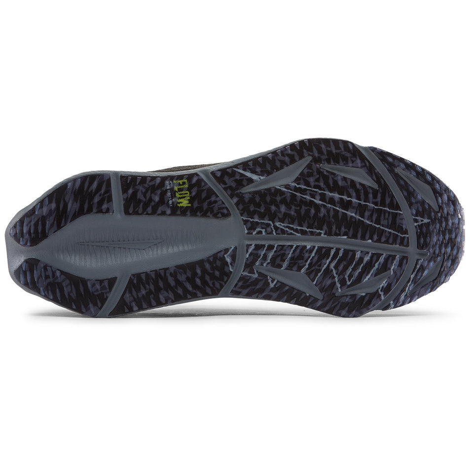 Close-up of a black and gray athletic shoe sole on a white background