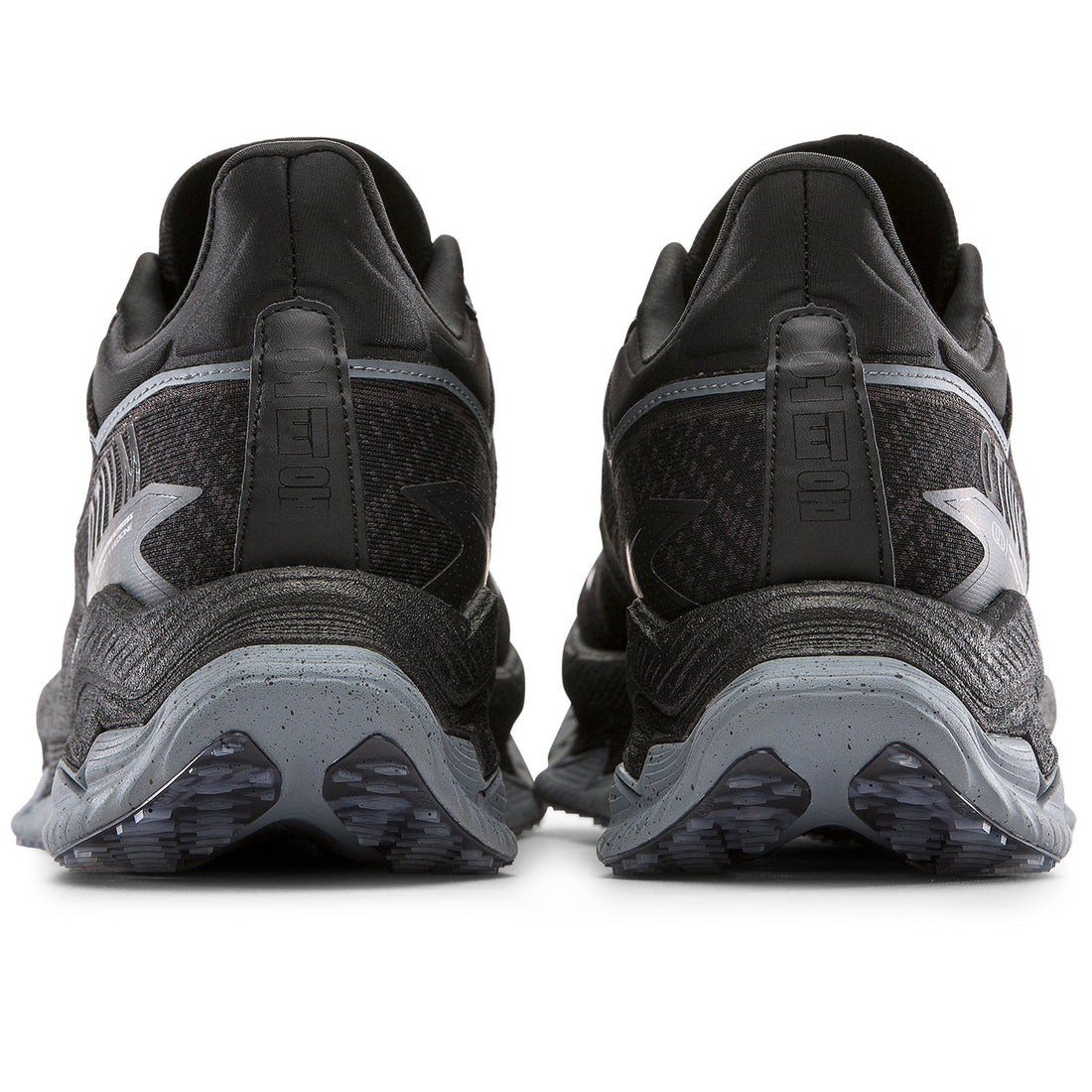 Black running shoes with visible sole design on a white background