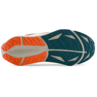 A close-up, top-down view of a shoe's outsole, showing a dark teal green tread pattern with a bright orange rear section and a light gray center stripe.