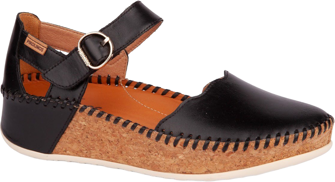 Black and brown sandal with cork sole on a white background