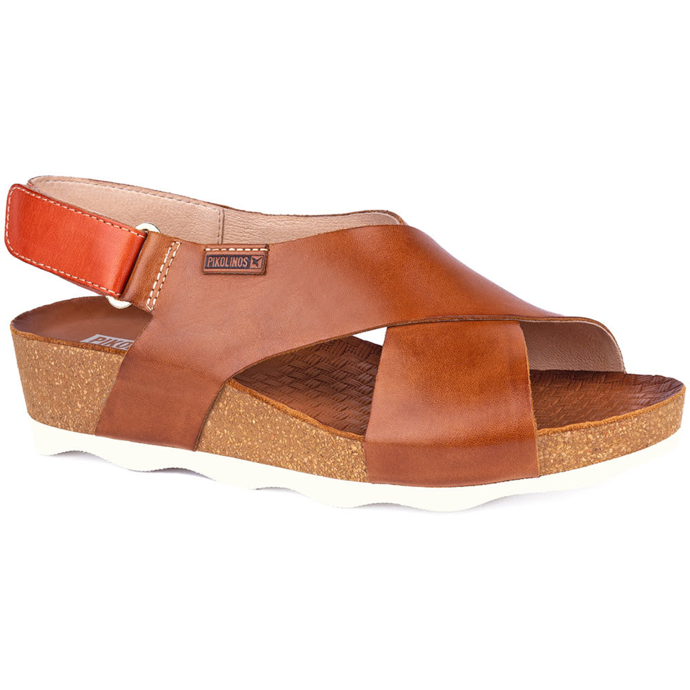 Brown sandal with brown straps on a white background