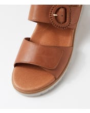 Ziera Vatch wedge sandal in tan leather with adjustable straps, cushioned footbed, and mid-height wedge sole on a white background