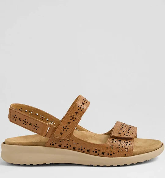 Tan sandal with a strap on a light gray background